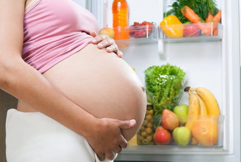 Pregnant Woman Avoiding Unhealthy Foods